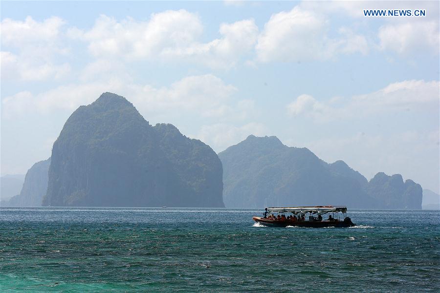 A ferry carrying tourists sails in Palawan Province, the Philippines, Feb. 18, 2016.