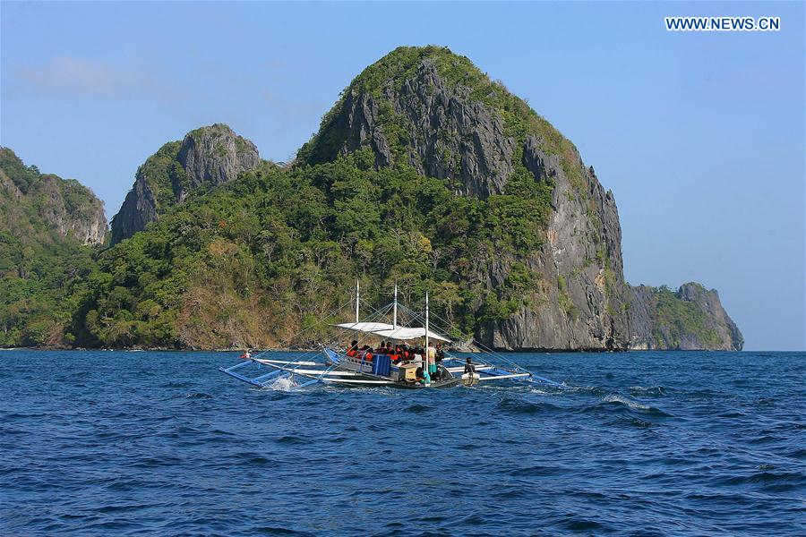 A ferry carrying tourists sails in Palawan Province, the Philippines, Feb. 18, 2016.